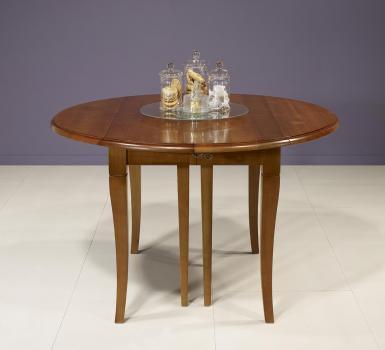 Mesa de comedor redonda,diámetro 110, extensible y con alas abatibles,fabricada en madera de cerezo macizo al estilo Louis Philippe 
